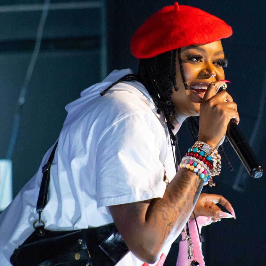 Karla Jones speaking on stage with a microphone